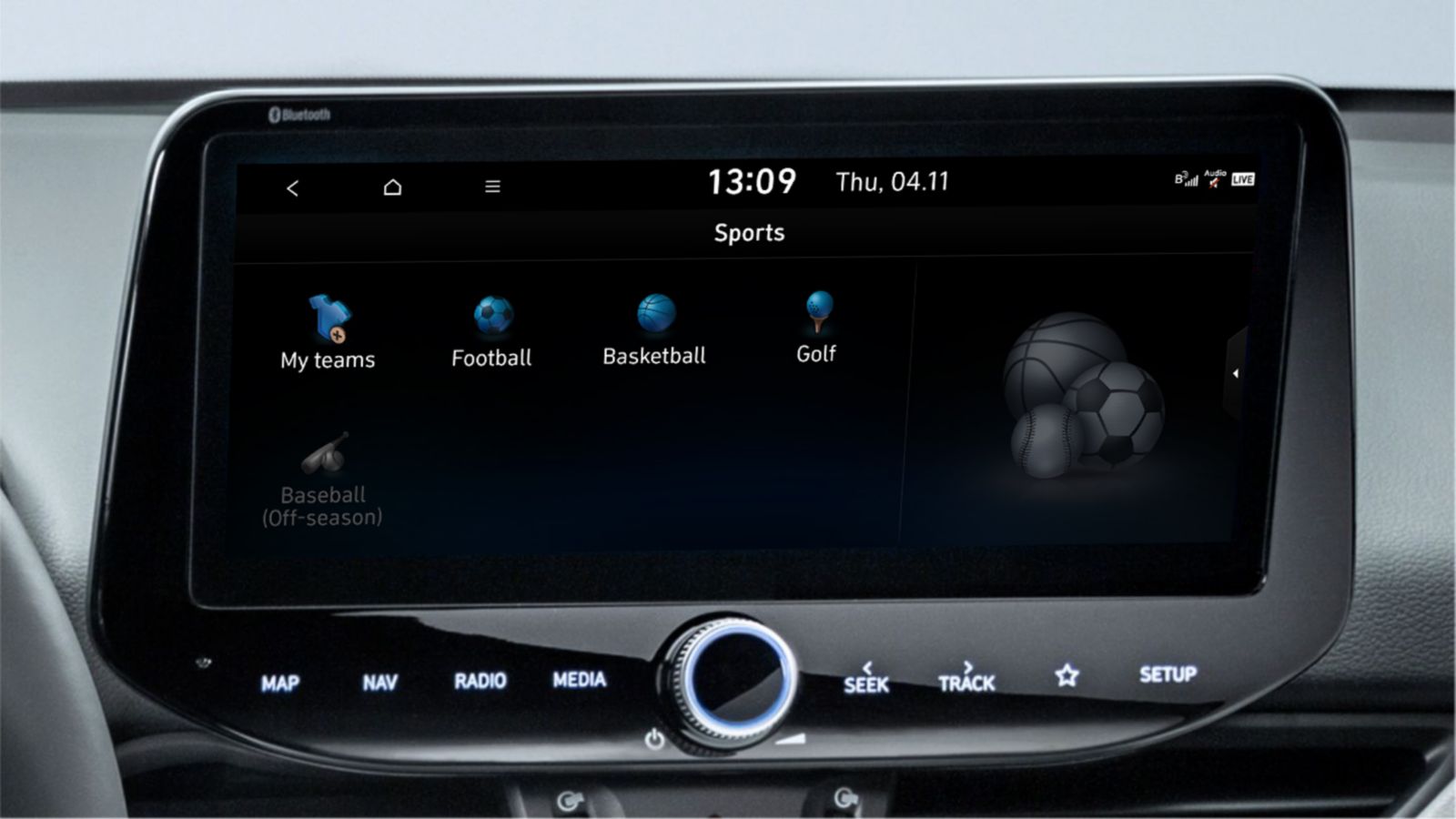 A Hyundai centre touch screen displaying the various sports results which are accessible: Football, basketball, golf and baseball.